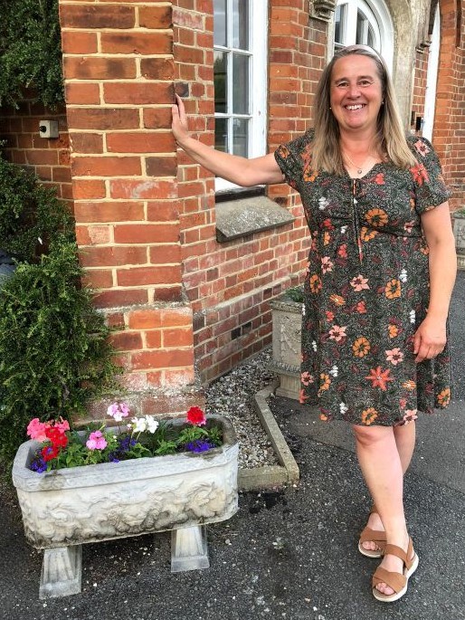 A resident with planters full of flowers